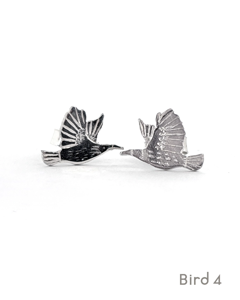 Sterling silver starling stud earrings, Bird 4 design, an engraved starling in flight, on white