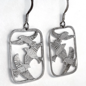 Sterling silver three bird drop earrings face-on, three saw-pierced starlings in flight within each open frame
