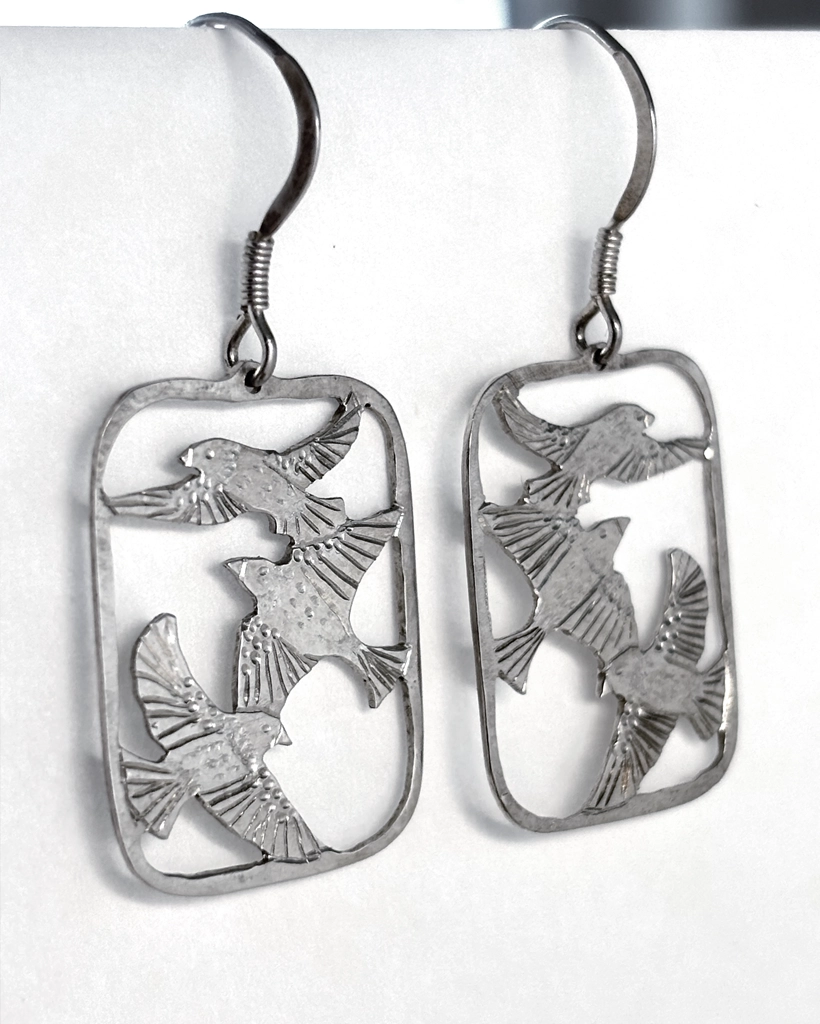 Sterling silver three bird drop earrings face-on, three saw-pierced starlings in flight within each open frame