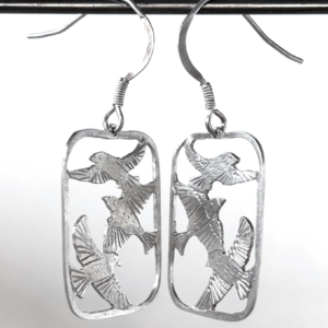 Sterling silver drop earrings, each an open frame holding three saw-pierced starlings in flight, on hook wires