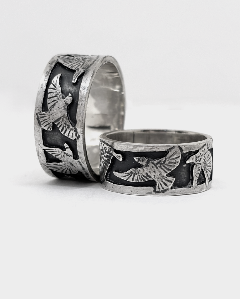 Sterling Silver Starling Band Ring, Oxidised Wide Statement Ring Two wide sterling silver bird rings with starlings in flight raised bright against an oxidised blackened band