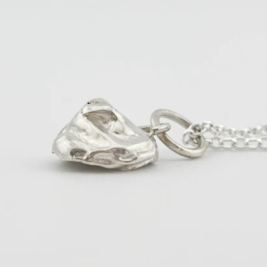 a water cast 925 sterling silver pendant in the shape of a birds nest with eggs