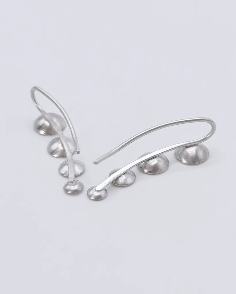 Back view of 925 sterling silver ear climber earrings, showing the curved wire which is inserted into the ear.