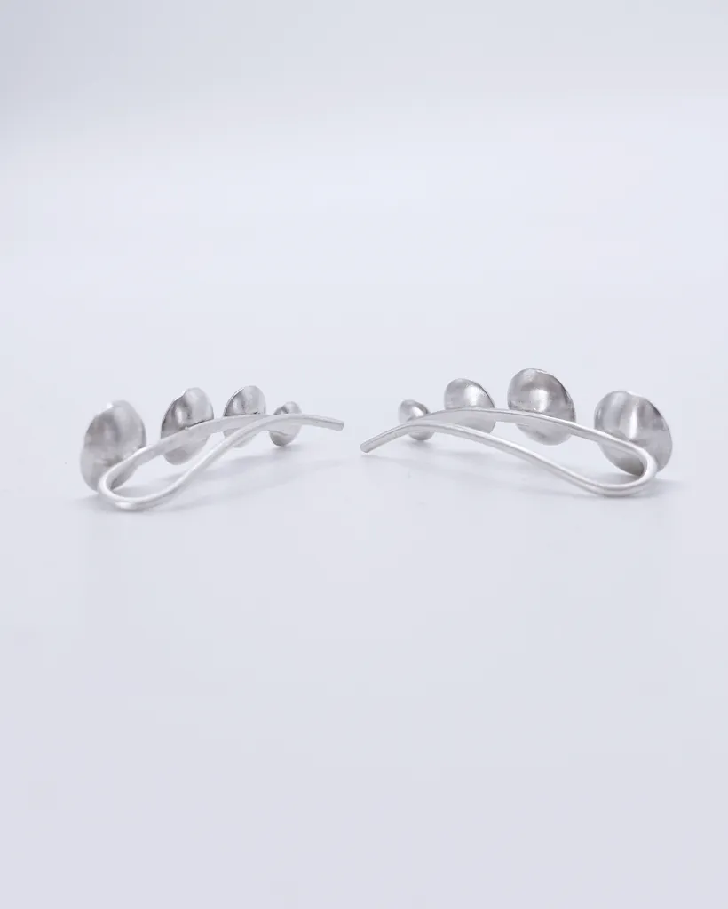 Back view of 925 sterling silver ear climber earrings, showing the curved wire which is inserted into the ear.