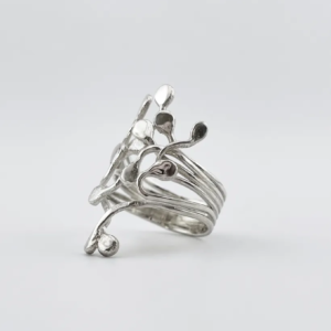 Three-quarter studio view of the handmade sterling silver Squiggle ring showing the layered split band and organic climbing tendrils on a white background.