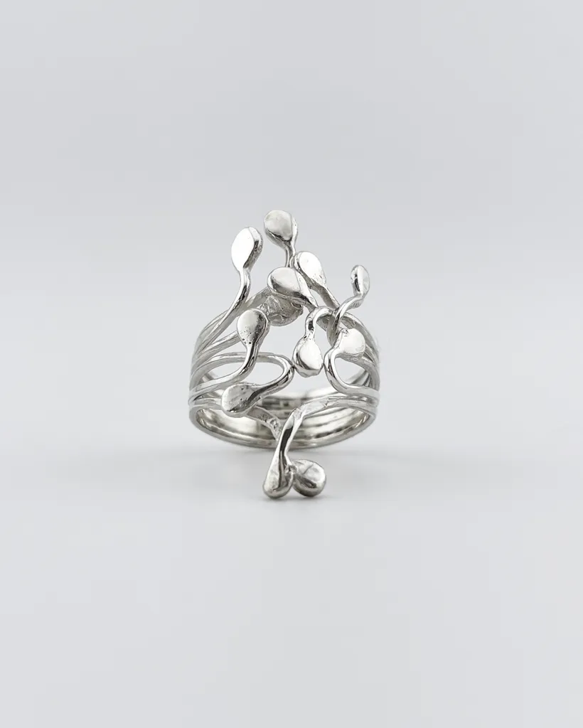 Front view of sterling silver Squiggle ring with climbing tendrils. Handcrafted artisan jewelry by Stacy Bias.