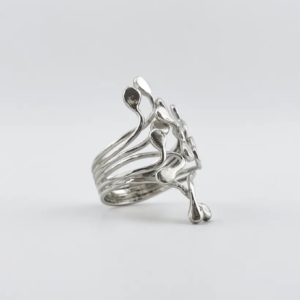 Profile studio shot of the handmade sterling silver Squiggle ring showing the multi-strand split band construction and fluid metal droplets on a white background.