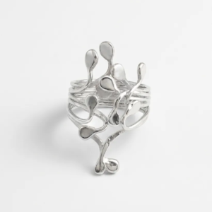 Top down studio view of sterling silver Squiggle ring with polished droplets. Handcrafted by Stacy Bias.