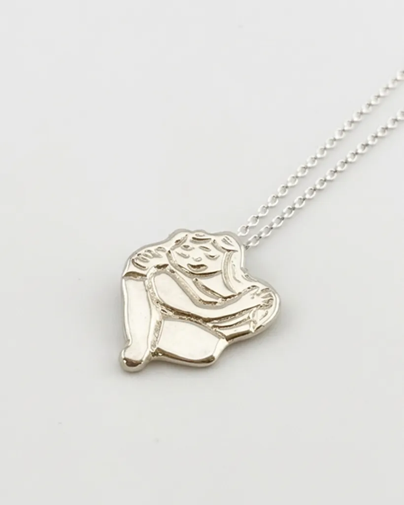 Chunky silver Self Love pendant showing a figure hugging themselves on a chain. Handcrafted by Stacy Bias.