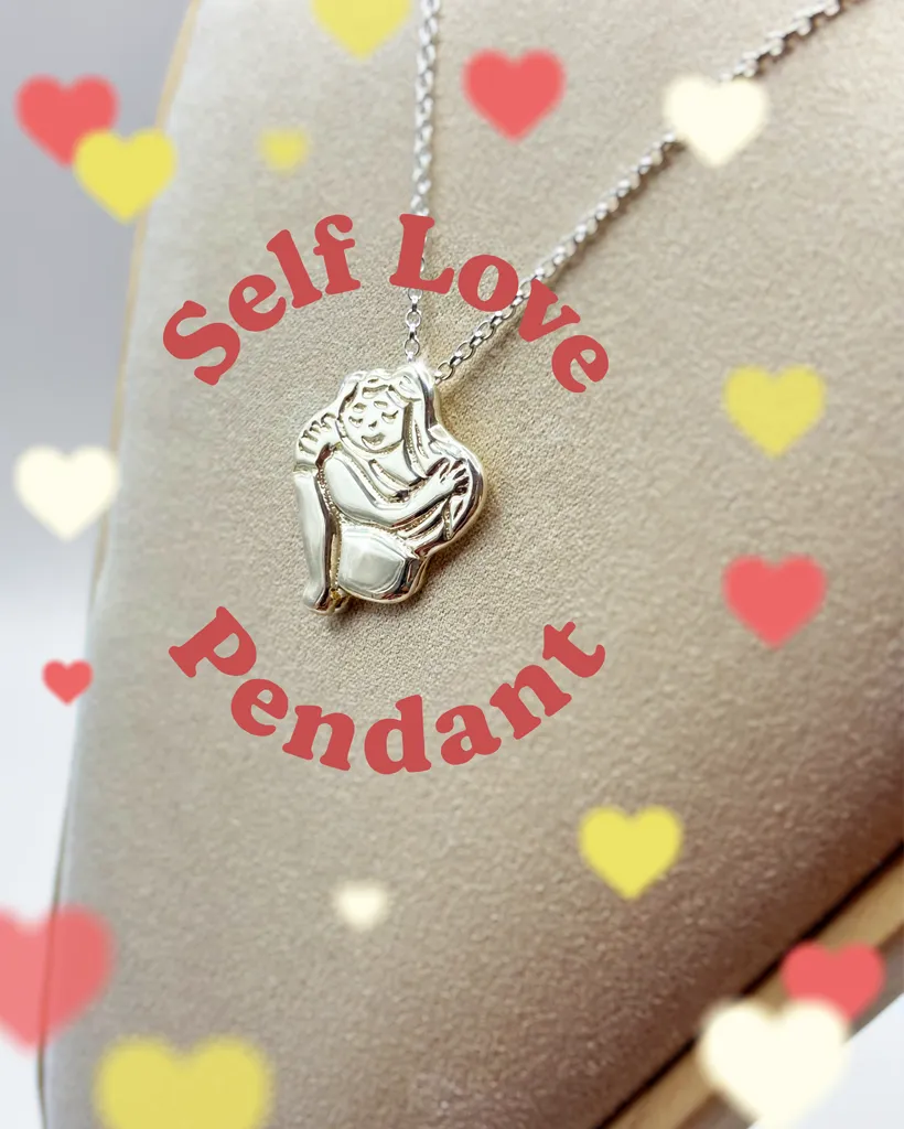 Chunky silver Self Love pendant necklace on a display bust with heart graphics and overlay text. By Stacy Bias.