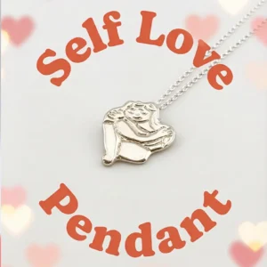Chunky silver Self Love pendant on a white background with heart graphics and text overlay. By Stacy Bias.